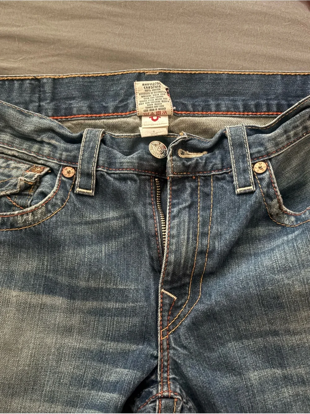 True Religion Men's Straight Jeans in Medium Blue with Distressed Hem